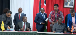 Screengrab image of Ruto and Raila signing an agreement.